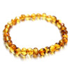 Baroka stila medus krāsas pulēta dzintara rokassprādze 