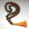 Islāma lūgšanu krelles (Misbaha / Tasbih) no tumšā konjaka Baltijas dzintara (33 bumbiņas)
